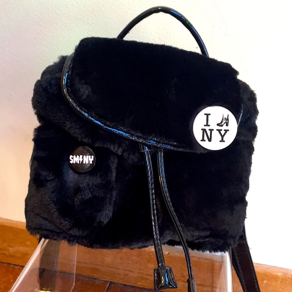 Steve Madden. Black faux fur mini backpack. EUC. Gold lhardware. Zipped pocket